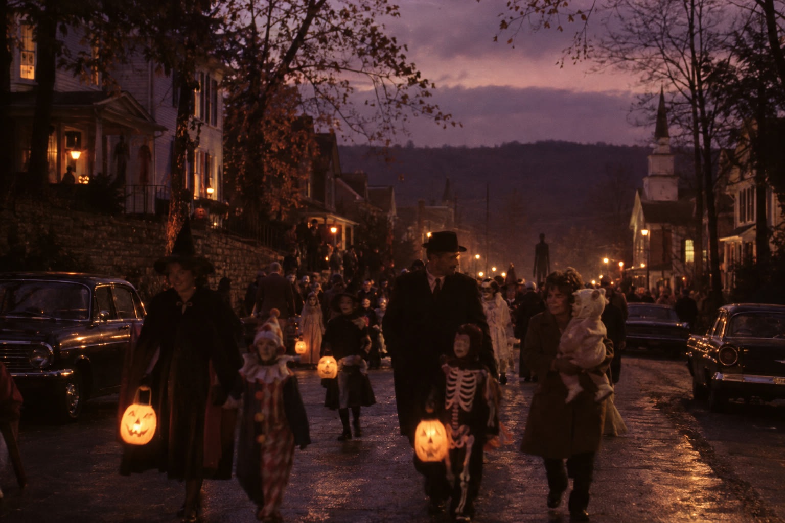 Blackridge families carry lanterns through the Halloween parade